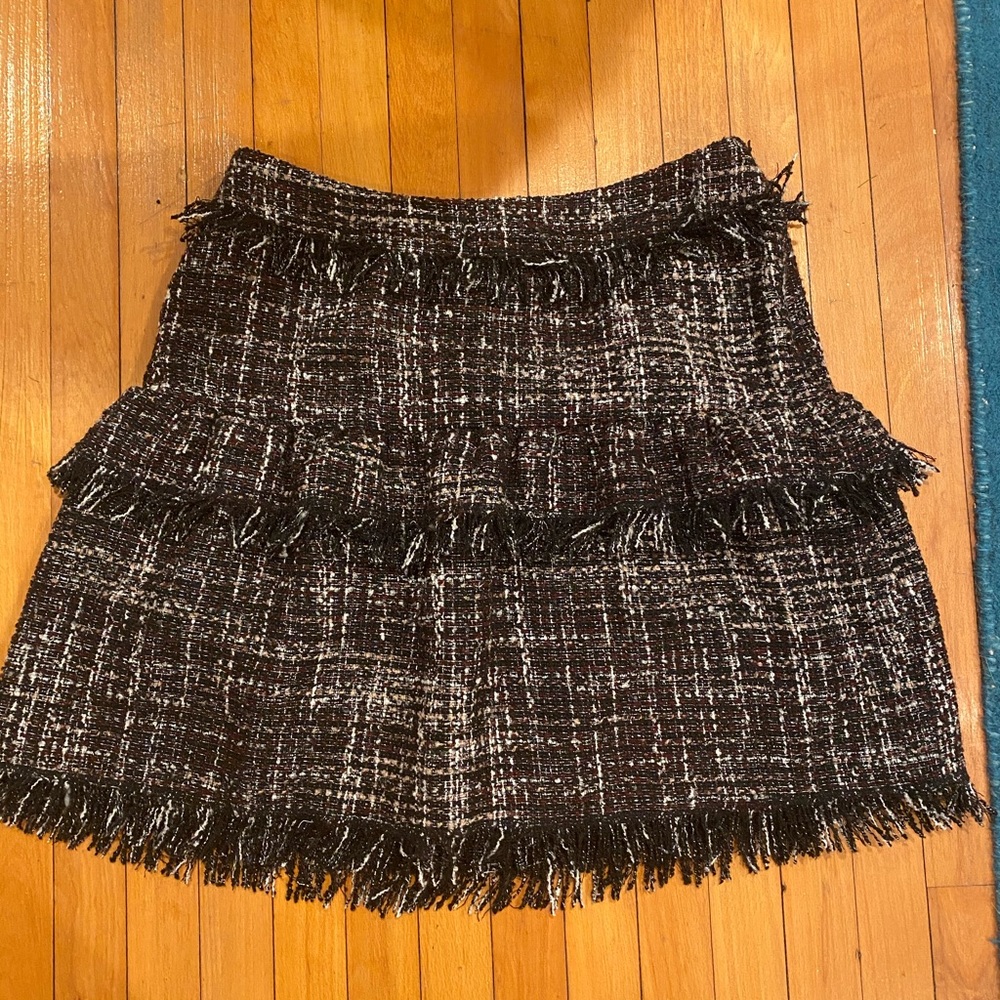 Pleated and frayed knee length skirt